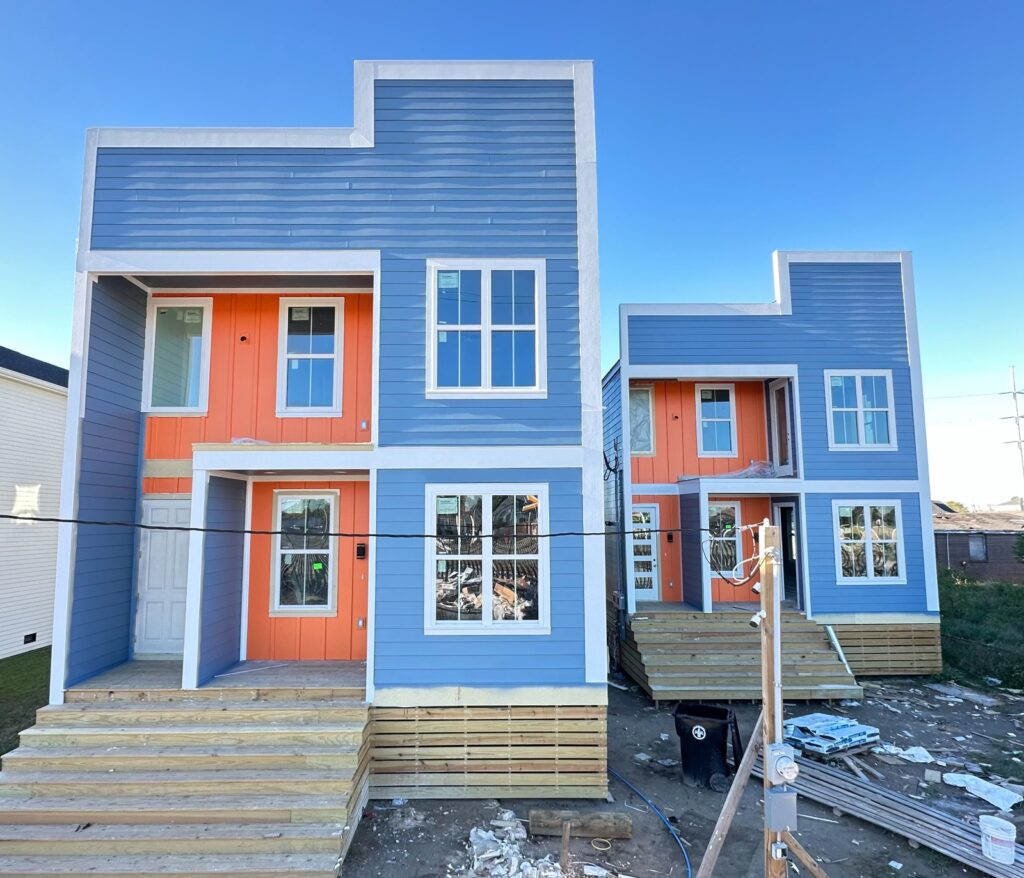 Investment property builders in New Orleans built by Ducar construction company. Two Blue and Orange properties for sale.