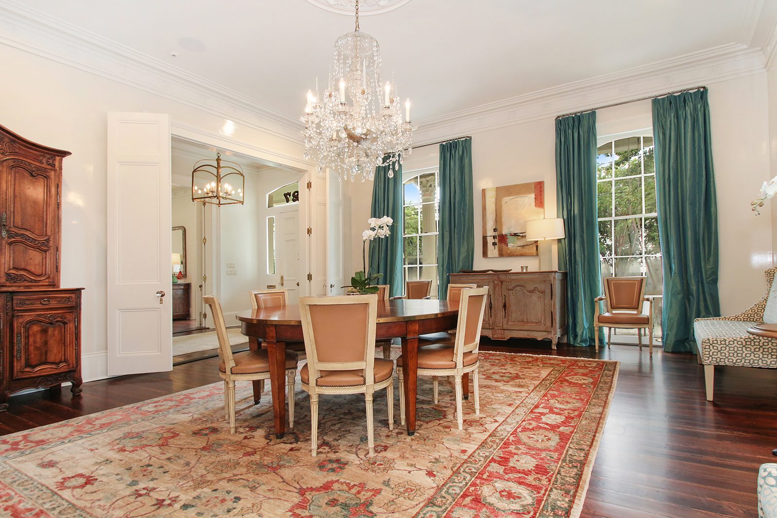 Formal dining room with chandelier after renovation of a Garden District home