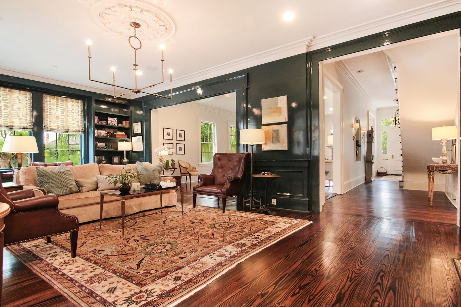Lacquered library with built-in shelving after custom renovation New Orleans
