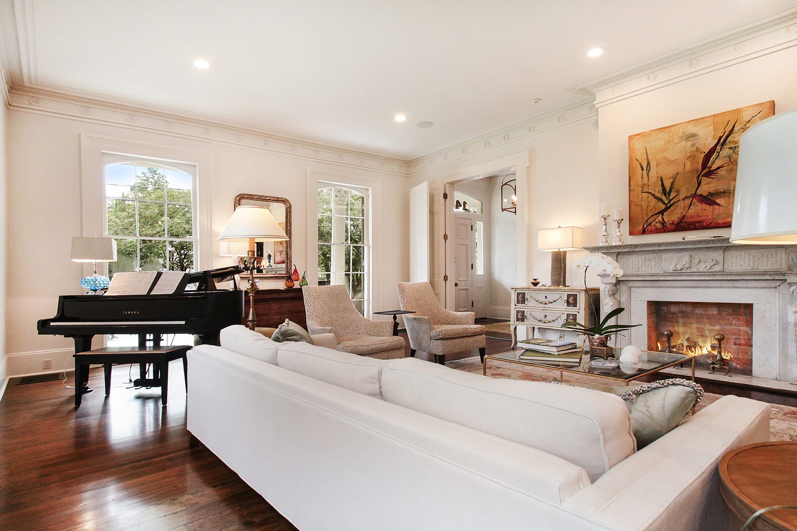Formal living room with grand piano after historic home renovation New Orleans
