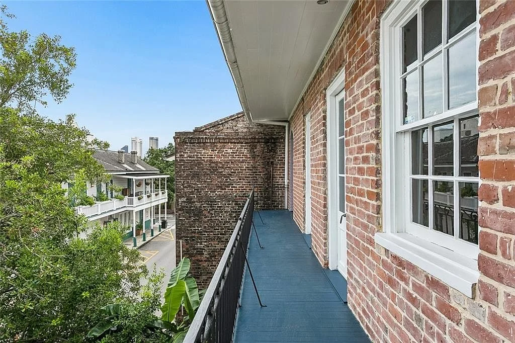 A private balcony over the side street — Esplanade Avenue, French Quarter, renovated by DuCar Construction