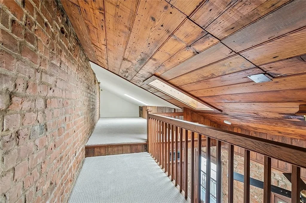 The added loft, under a wood ceiling — Esplanade Avenue, French Quarter, renovated by DuCar Construction