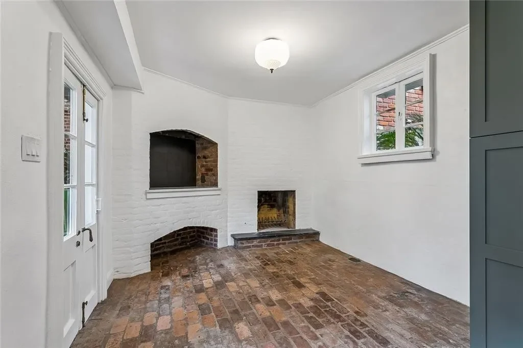 Original brick hearths, kept — historic Esplanade Avenue building renovated by DuCar Construction, New Orleans