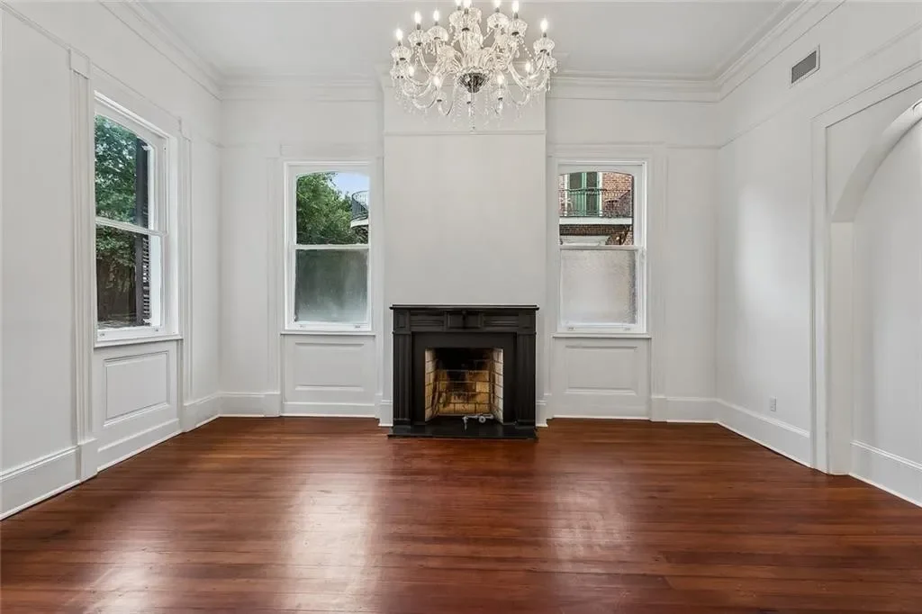 Parlor with the original mantel — historic Esplanade Avenue building renovated by DuCar Construction, New Orleans