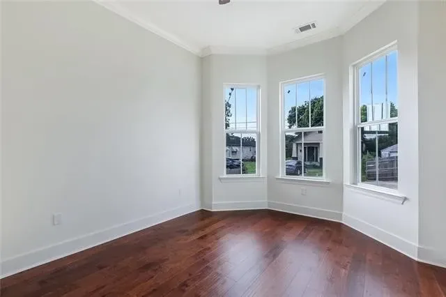 Bedroom with a three-window bay in a DuCar new home in New Orleans